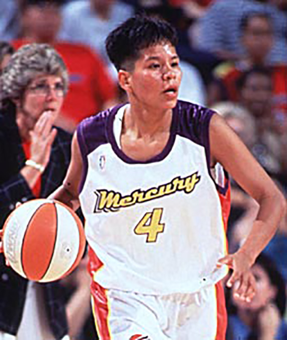 Ryneldi Becenti, the first Native American basketball player for the WNBA. Ryneldi runs and dribbles the basketball across the court.