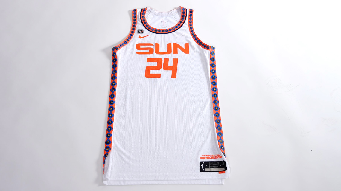 The Connecticut Sun’ Heroine uniform with the Mohegan Tribe’s symbol of the rising sun on the trim around the edges of the uniform.
