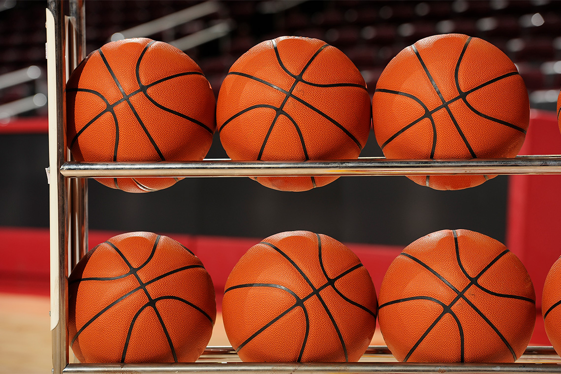 Basketball rack with basketballs ready for the game.