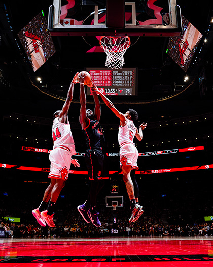 Pascal Siakam, #43 of the Toronto Raptors (2023), jumps to dunk the basketball into the basket; opposing players jump to defend.